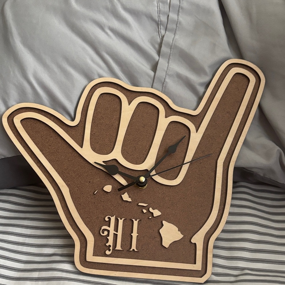 Brown and tan Shaka clock